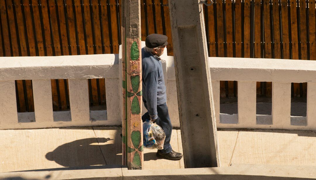 Children playing football on a dirt street in a Chilean town