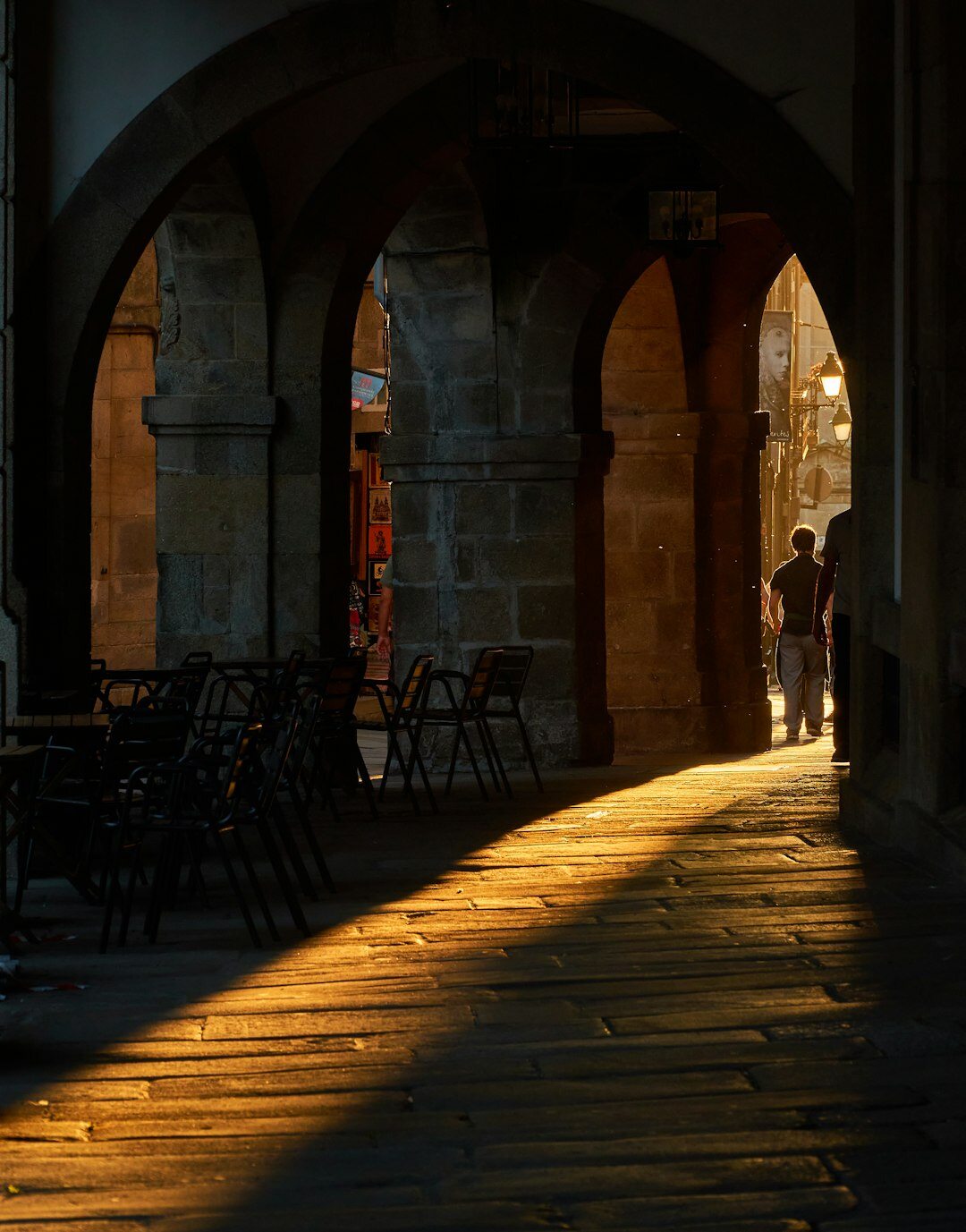 Afternoon light over a plaza in central Santiago with people resting