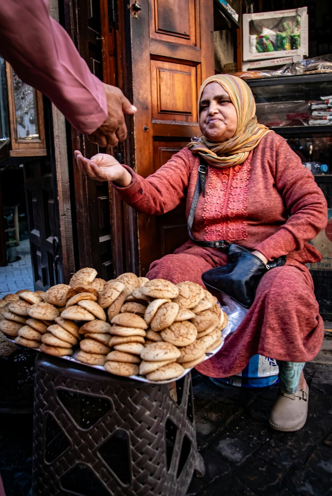 Chilean woman selling bread at a local street market stall