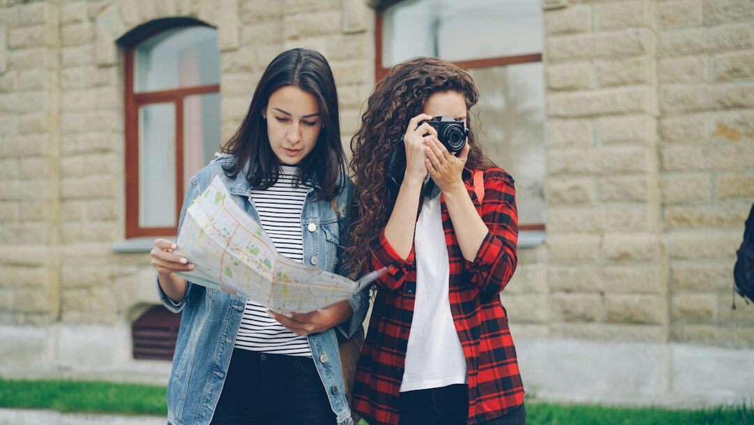 young people looking at photos